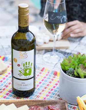 KRIS Pinot Grigio being enjoyed in a picnic setting.